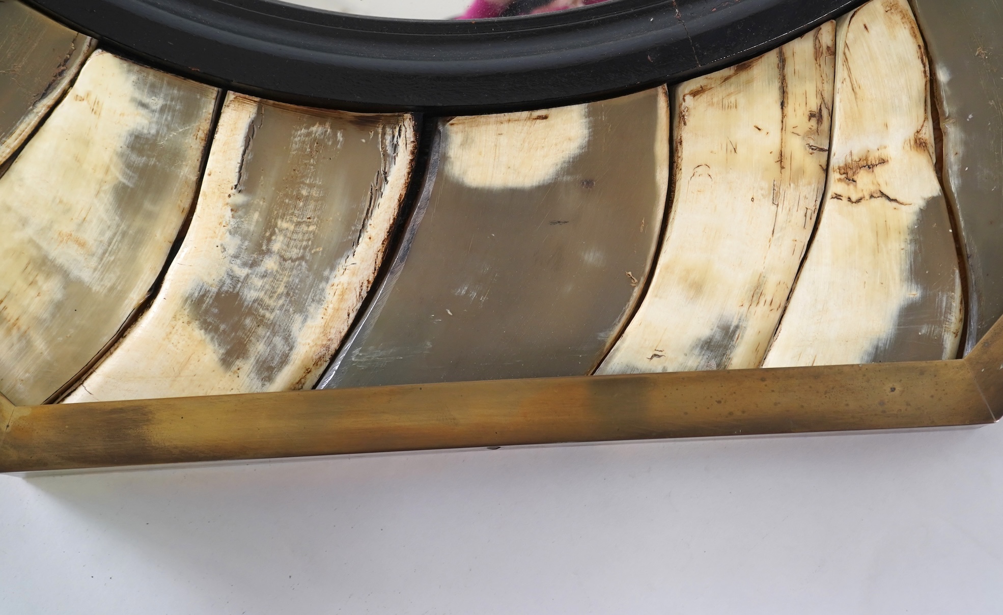 Anthony Redmile (b. 1940) An ebonised wood and horn mounted octagonal convex wall mirror
